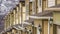 Panorama Close up of townhouses exterior with wide garage doors and white wall sidings