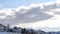 Panorama Clouds and blue sky over homes on pristine terrain of Wasatch Mountains