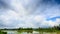 Panorama of Cloudy Sky over Rice Field in Water Forest Village