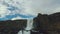 Panorama from cloudy sky to waterfall Oxararfoss on basalt rocks in Iceland in autumn day