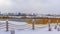 Panorama Clubhouse overlooking lake and homes against cloudy sky on a frosty winter day
