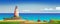 Panorama of the coast with a rocky sea reef. Brick lighthouse on the shore. Green hills, sandy beach, fishing boats on the shore.