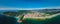 Panorama of coastline with beach, mountains and ocean in Brazil. Aerial view of Barra da lagoa in Florianopolis