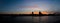 Panorama of Cologne skyline silhouette at sunset with colorful sky