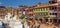 Panorama of colorful buildings around the Boudhanath stupa in Kathmandu