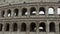 Panorama of Colosseum exterior, grey antique ruins of amphitheater columns