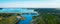 Panorama of concrete Dam at reservoir with flowing water, hydroelectricity power station, aerial view, drone shot