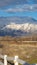 Panorama Construction site near a lake viewed on the other side of a white picket fence