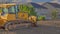 Panorama Construction sitewith yellow bulldozer against homes and mountain on a sunny day