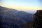 Panorama with contrasting colors of the mountains at sunset, Wadi Ghul the Oman`s Grand Canyon, Jabal Akhdar, Sama Heights, Oman