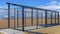 Panorama crop Baseball field dugout with slanted roof and chain link fence on a sunny day