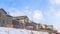 Panorama crop Wasatch Mountain residential area with homes against clouds and blue sky