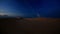 Panorama of Dark Dunes under Cloudy Sky at Deep Sunset