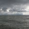 Panorama of dark sky and sea waves