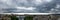 Panorama of dark thunderstorm sky hovering over Varna. Dramatic cloudscape over seaside city. Scenic stormy clouds on a summer day