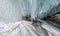 Panorama dawn in an ice cave with icicles on Baikal, Olkhon