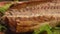 Panorama of delicious fragrant smoked mackerel fish on the plate with a salad
