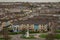 Panorama of Derry or Londonderry on a cloudy day viewed from the city walls. Green panorama of the city, residental houses visible