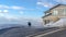 Panorama Dog on the driveway of a home overlooking Wasatch Mountain and cloudy blue sky