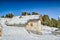 Panorama of the Dolomites with wood cottage, snowy mountains and