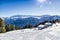 Panorama of the Dolomites with wood cottage, snowy mountains and