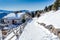 Panorama of the Dolomites with wood cottage, snowy mountains and