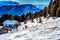 panorama of the Dolomites with wood cottage, snowy mountains and