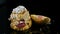 Panorama down on sliced single french dessert choux pastry with caramel cream and cherry