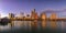 Panorama with downtown view across Lady Bird Lake or Town Lake on Colorado River at sunset golden hour, Austin Texas USA