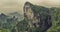 Panorama: Dramatic artistic view of The Tianmen Mountain Peak with a view of the cave Known as The Heaven`s Gate surrounded by th