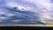 Panorama of dramatic colorful sky, cloud patterns and storm front over Sydney and suburbs at sunset