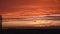 Panorama of dramatic orange sky. Sunrise sun over horison. Beautiful red morning winter sky.