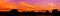 Panorama dramatic sunset in sky beautiful colorful which has sun light orange landscape silhouette tree woodland twilight time wit