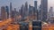 Panorama of Dubai Financial Center district with tall skyscrapers with illumination night to day timelapse.