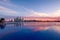 Panorama of Dubai Marina at sunset with a swimming pool in front