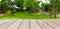 Panorama empty old wooden table in front of blurred tree in the forest and nature background. Can be used for display or montage