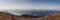 Panorama of the entire Wolfgangsee lake overlooking the surrounding alps in daylight. A beautiful hike to a magical place near