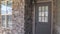 Panorama Entrance door to a house with feature brick wall