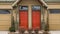 Panorama Entrance of townhouses with vibrant glass paned front doors and garage doors