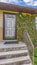 Panorama Facade of a home with view of the garage door and front door against blue sky