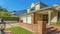 Panorama Facade of a house with a patio and outdoor stairs paved with rustic red bricks