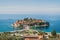 Panorama of famous Aman Sveti Stefan with a promenade and beaches, Montenegro. Top view, St. Stephen islet, Budva