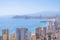 Panorama of famous Benidorm resort city. Coast of Mediterranean sea, Benidorm skyscrapers, hotels and blue sky and