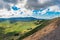 Panorama of the famous Serra do Cume and pastures divided by volcanic stone walls with dramatic sky  Terceira - Azores PORTUGAL