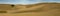 Panorama of the famous stunning sand dunes in the Natural Reserve of Dunes of Maspalomas in Gran Canaria, Spain