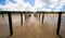 Panorama on farmed mussels aquaculture at low tide. Golden sand and beach.