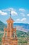 Panorama of Finestrat with Church of Saint Bartholomew and old bell tower and mountains background. Costa Blanca, Spain