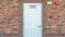 Panorama Fire Riser Room sign on the white wood door of a building with red brick wall