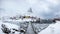 Panorama of fishing village in snow steep mountain with wooden b