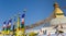 Panorama of flag poles at the Boudhanath stupa in Kathmandu